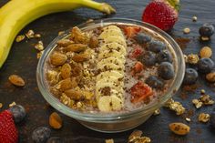 a bowl of oatmeal with fruit and nuts