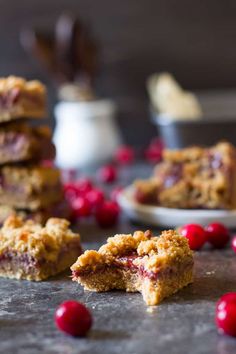 cranberry bars are stacked on top of each other and ready to be eaten