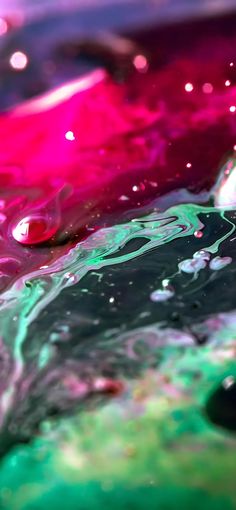 an abstract painting with pink, green and purple colors