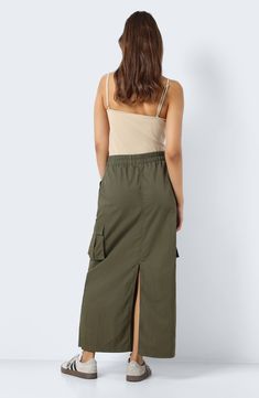 The classic maxi skirt gets a utilitarian update in this nylon version featuring a comfy pull-on waist, roomy cargo pockets and a slit at the back. 38" length (size Medium) Elastic waist Side cargo pockets 100% nylon Machine wash, dry flat Imported Long Cargo Skirt Outfit, Cargo Skirt Outfit, Mesh Maxi Skirt, High Rise Skirt, Denim Maxi Skirt, Cargo Skirt, Sporty Outfits, Green Skirt, Skirt Outfits