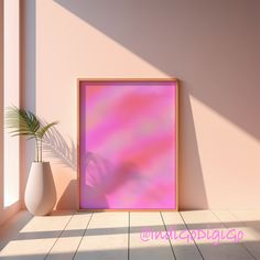 there is a pink and purple painting on the wall next to a potted plant