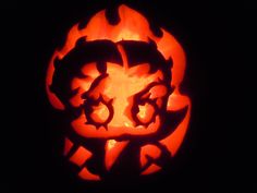 a carved pumpkin with an evil face on it