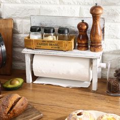 bread, salt and pepper shakers sit on a table next to an avocado