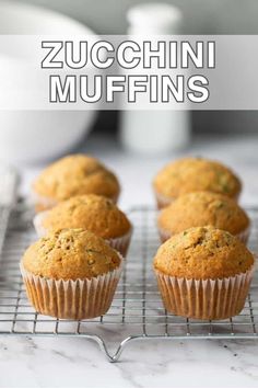 zucchini muffins on a cooling rack with the title overlay reading zucchini muffins