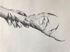 two hands holding each other over a piece of paper that has been drawn on it