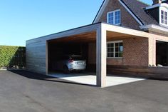 a car is parked in the garage with its door open to let people know what's inside