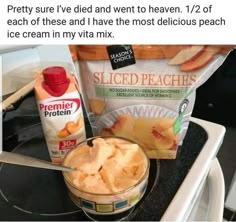 a bowl of sliced peaches next to a bag of ice cream