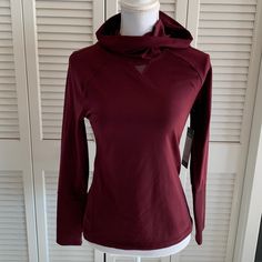 Workout In Style Wearing This Maroon Yogalicious Lux Sweat Wicking Hoodie. Mesh Panels At Front Neck And Across The Back At Shoulders Down To Below Armpits. Great For Layering Over Your Favorite Workout Tank Or Under A Heavier Coat. Tight Fitting Hood To Keep You Warm On Chilly Days. The Perfect Workout Hoodie. 8” Trim At Bottom Of Sleeves Of Different Fabric Adds Style, Looks Cute Rolled Up. New With Tags. Women’s Size Small. Style Lsy94491 Color Cabernet Measurements Flat: 17.5” Pit To Pit 26. Red Moisture-wicking Long-sleeved Activewear, Red Hooded Activewear For Gym, Long Sleeve Workout Hoodie For Winter, Long Sleeve Workout Hoodie, Athleisure Hoodie Tops For Fall, Winter Workout Hoodie With Long Sleeves, Fall Athleisure Hoodie Top, Red Long Sleeve Sportswear Activewear, Winter Workout Long Sleeve Hoodie