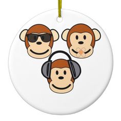 three monkeys wearing headphones and sunglasses on a white ornament with yellow cord