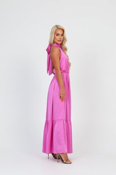 Satin Maxi Dress For Garden Party, Pink Floor-length Dress With Tie Back, Pink Sleeveless Dress For Wedding Guest, Pink Tie Back Floor-length Dress, Satin Tie Back Dresses For Wedding Guests, Pink Halter Dress For Spring Wedding, Sleeveless A-line Wedding Dress With Ruffles, Pink Fitted Halter Dress For Wedding, Long Satin Dress With Tie Back