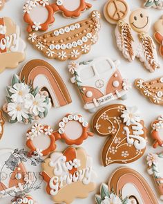 many decorated cookies are laying on the table