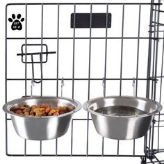 two stainless steel bowls with food in them on a wire rack and paw print tag