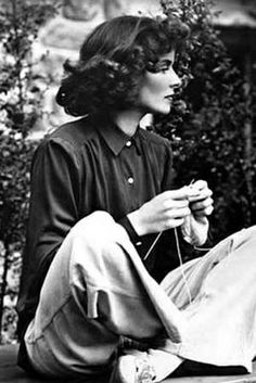 black and white photograph of a woman knitting