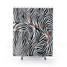 a shower curtain with black and white zebras on the front, orange fish on the back