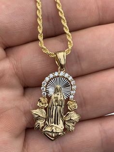 "Beautiful handmade Iced Out Floral Virgin Mary pendant 14k yellow gold over SOLID 925 SILVER. Roughly 1\" in size. Pendant weighs 5 grams! Super Icy cz adorns top of pendant Amazing handmade piece You can buy pendant alone or with choice of 2mm solid 925 silver (14k gold plated) chain. Chain is Made in Italy & comes in 16-30\" IF YOU ONLY WANT PENDANT, PLEASE SELECT \"0\" LENGTH Pendant will fit most chains up to 3mm thick Ships fast Let us know if you have any questions!" Virgin Mary Pendant, Y2k Fits, Gold Chain With Pendant, Girly Jewelry