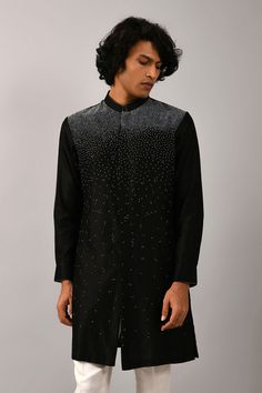 Black short kurta with all-over thread work. Comes with ivory cotton pants.
Components:2
Embroidered
Neckline:Mandarin Collar
Sleeve Length:Full
Fabric:Chanderi, Cotton
Color:Black


Cuff sleeves
Closure: Kurta: Concealed front placket - Aza Fashions Cape Jumpsuit, Kurta Set For Men, Short Kurta, 2022 Wedding, Nehru Jackets, Jumpsuit Skirt, Embroidered Neckline, Fashion App, Thread Work