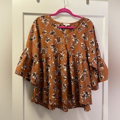 Brand New Floral Blouse Color Is A Burnt Orange/Brown Color Size M Bought From A Local Boutique Orange Brown Color, Local Boutique, Orange Brown, Brown Orange, Floral Blouse, Burnt Orange, Brown Color, Top Blouse, Blouses