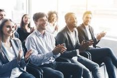 a group of people sitting next to each other