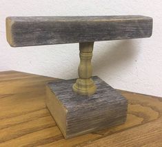 a wooden bench sitting on top of a wooden table