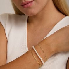 *Buy 2 items, Get 15% OFF your order. Coupon applied at checkout.* Have fun with our classic pearl bracelet. Perfect for that special occasion such as a birthday or wedding. Our timeless pearl bracelet elevates any day or night look. - Fresh water pearls, 18K gold vermeil - Bracelet width: 4.6mm - Adjustable size. Fits wrist sizes 6 - 8 inches. - Waterproof / Tarnish resistant / Hypoallergenic - 1 Year warranty All jewelry is handmade by hand from Heart Made of Gold. Style with our Pearl Strand Classic Chain Bracelet With Pearl Charm As Gift, Feminine Pearl Bracelets As Gift, Feminine Beaded Bracelets For Wedding, Classic Pearl Charm Chain Bracelet As Gift, Elegant Pearl Chain Bracelet As Gift, Feminine Pearl Bracelet For Gifting, Elegant White Charm Bracelet For Mother's Day, Elegant Beaded Bracelet For Mother's Day, Classic White Pearl Chain Bracelet