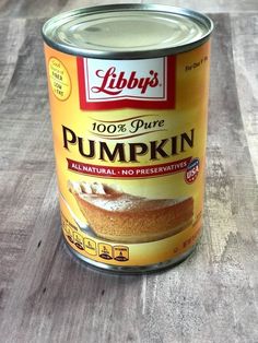 a can of pumpkin pudding sitting on top of a wooden table