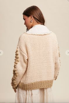 Crochet, flower detailed cardigan. Chic Chunky Knit V-neck Cardigan, Chic Beige Chunky Knit Cardigan, Spring Textured Knit Sweater Coat For Layering, Spring Layering Textured Knit Sweater Coat, Beige Textured Knit Cardigan For Layering, Chic Long Sleeve Chunky Knit Cardigan, Bohemian Textured Knit Cardigan For Fall, Bohemian Textured Knit Sweater For Spring, Chic Cream Knitted Cardigan