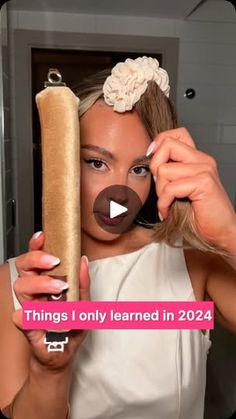 a woman holding a long hot dog in front of her face with the caption things i only learned in 2020