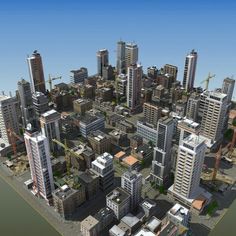 an aerial view of a city with tall buildings