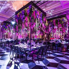 an elaborately decorated dining room with purple lighting