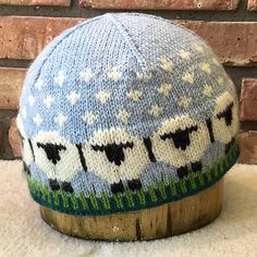 a knitted hat with sheep on it