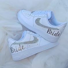 a pair of white nike air force sneakers with the word bride painted on them