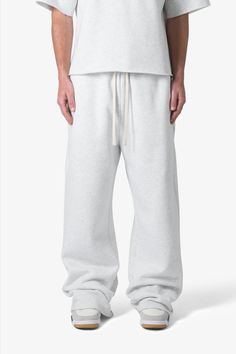 the Washed Ultra Baggy Sweatpants are designed with a baggy fit throughout, featuring an elasticized self waist, tonal cotton drawstrings, standard hem at the leg opening, and finished in both a washed and brushed fleece fabric. details baggy fit 100% cotton, 360 gsm model is 6’1, 140 lbs and wears a size medium note: this fit is intentionally baggy in waist and fit, for a more relaxed fit we recommend sizing down Affordable Baggy Sweatpants, Wide Legged Sweatpants, Baggy White Sweatpants, White Baggy Sweatpants, Baggy White Pants, Pants Essentials, Baggy Grey Sweatpants, Baggy Sweatpants Outfit, Baggy Sweats