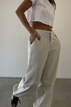 l Oversized Pants    l 100% Polyester   * MODEL IS 5'7″ AND IS WEARING A SMALL. Relaxed Baggy Pants For Everyday, Relaxed Baggy Everyday Bottoms, Sporty Beige Straight Leg Bottoms, Casual Wide Leg Parachute Pants For Everyday, Wide Leg Solid Cargo Pants For Everyday, Relaxed Wide Leg Parachute Pants With Pockets, Relaxed Wide-leg Pants For Streetwear, Everyday Baggy Wide-leg Pants, Oversized Pants