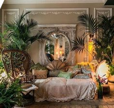 a living room filled with lots of plants and furniture