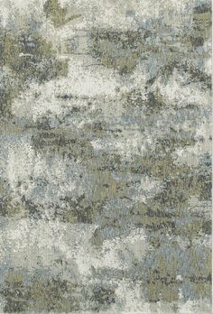 an area rug with various colors and patterns on the carpet, including grays, greens