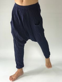 "These super soft rayon baggy unisex harem pants have the \"flow\", perfect of yoga or just a cool strolling. Comfort and character are what these pants are all about. They have the traditional sarong look & feel but a lot more practical when it comes to activity like yoga. As a bonus, they are convertible! Just pull them up and you get yourself a cute jumpsuit in a flash. Together with elastic cuff legs, you can wear them short or long. The pants have smock waist (wide bang elastic) with no Comfortable Baggy Wide Leg Harem Pants, Baggy Wide Leg Harem Pants, Comfortable Baggy Harem Pants For Yoga, Baggy Harem Bottoms With Elastic Waistband, Comfortable Baggy Pants With Tapered Leg, Baggy Comfortable Harem Pants, Comfortable Relaxed Fit Harem Pants, Comfortable Baggy Tapered Leg Pants, Comfortable Baggy Harem Pants With Pockets