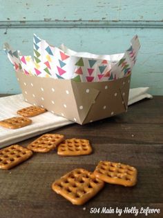 some pretzels sitting on top of a table next to a paper bag and napkin