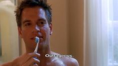 a shirtless man brushing his teeth in front of a mirror with the words outraggeous on it