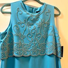 Beautiful Beaded Long Gown, Perfect For Wedding Guest Or Bride’s Maid! Sleevess With Beaded Details Size 14 Nwt. Blue Wedding Dress With Pearl Embroidery, Floor-length Embellished Evening Dress For Wedding, Sleeveless Rhinestone Evening Dress For Wedding, Sleeveless Beaded Prom Gown, Sleeveless Beaded Gown For Prom Season, Sleeveless Beaded Gown For Prom, Formal Beaded Sleeveless Gown, Formal Sleeveless Beaded Gown, Elegant Blue Dress With Pearl Details