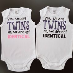 two white onesuits that say yes, we are twins and identical