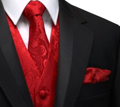 a man in a black suit and red tie