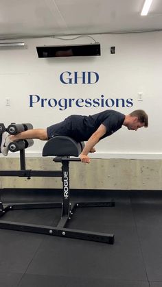 a man is doing push ups on a bench