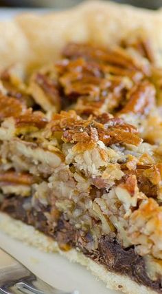 a piece of pecan pie on a white plate