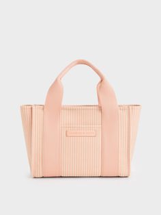 This product is made with at least 20% sustainable materials by weight. CHARLES & KEITH uses recycled, degradable, organic, and water-based materials in our eco-conscious collection.Complete your girly-girl summer outfits with this Kay striped tote bag in pretty pink -- it will add just the perfect amount of colour to brighten your look. Featuring a blend of denim and cotton, this tote bag is lightweight yet durable with plenty of room to store everything you want to have with you through the da Double Handle Bag With Striped Lining, Everyday Bags With Striped Lining, Functional Recyclable Bags, Striped Bags For Everyday Use In Spring, Casual Summer Bags Made From Recycled Materials, Striped Tote Bag, Girls Summer Outfits, Charles Keith, Sustainable Materials