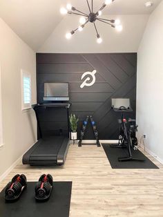 a home gym with treadmills and exercise mats