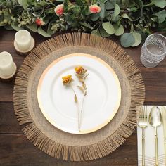 a place setting with flowers and candles