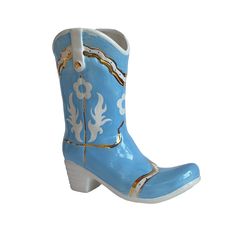 a blue and white cowboy boot with gold accents