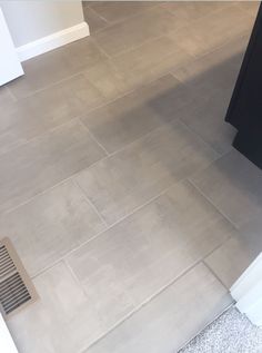 the bathroom floor is clean and ready to be used as a bathtub or shower