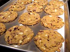 cookies are lined up on a cookie sheet ready to be baked in the oven,