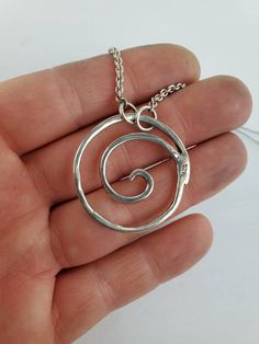 Sterling silver spiral pendant. Measures 1 1/4 x 1 1/4 inch. Has an attached 16 inch chain. Designed and handcrafted by Richelle Leigh using the lost wax casting process. Free shipping US. https://www.etsy.com/shop/RichelleJewelry Unique Spiral Sterling Silver Necklace, Spiral Hand Forged Sterling Silver Jewelry, Handmade Spiral Silver Necklace, Hand Forged Silver Swirl Jewelry, Hand Forged Silver Spiral Necklace, Handmade Silver Spiral Necklace, Spiral Pendant, Harrisburg Pa, Tree Sculpture